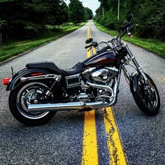 a motorcycle is parked on the side of the road