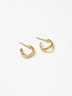 The perfect everyday earring. Made of 14K gold-plated bronze, this wavy, organic hoop shape elevates your everyday look. With 14K gold vermeil posts. 14mm in diameter Each piece of Wolf Circus jewelry is designed and handcrafted in Vancouver, Canada. Circus Jewelry, Wolf Circus, Earrings In Gold, Charm Rings, Makeup Shop, Vancouver Canada, Engraved Items, Everyday Earrings, Gold Vermeil