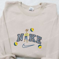 The Woody x Nike Disney Embroidered Sweatshirt is a must-have for any Disney fan. Made with premium quality materials, it Nike White Embroidered Collegiate T-shirt, Cute Nike Air Shirt, Cheap Sporty T-shirt With Embroidered Logo, Nike Boyfriend Tshirt, Sweet Shirt Nike, Cheap Nike Screen Print T-shirt, Cheap Nike Screen Print Tops, Leopard Print Nike Shirt, Custom Made Nike Shirts