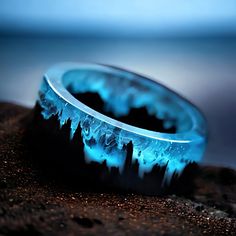 ✨ Elevate Your Style: Enchanting Blue Resin Ring with Wooden Mountains ✨ -Immerse yourself in the magic of this unique resin ring, a wearable piece of art that transports you to a tiny landscape within. Perfect for both women and men, this ring features wooden mountains embedded in captivating blue resin, creating a whimsical and punk-inspired piece with a touch of fantasy. 🔗 Key Features: -Magical Blue Resin: The enchanting blue resin captures a mesmerizing world within the ring, adding a touch of magic to your everyday style. -Wooden Mountains Inside: Delicately crafted wooden mountains are intricately placed within the resin, creating a tiny landscape that tells a unique story. -Unique for Women and Men: Versatile and unisex, this ring is designed to make a statement on any finger, mak Secret Wood Rings, Tiny Landscape, Cool Rings For Men, Mountain Ring, Magical Jewelry, Punk Jewelry, Resin Ring, Natural Scenery, 판타지 아트