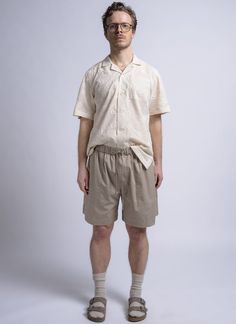 Bringing the outdoors to the city. the baggy camp short is designed with the comfort versatility and functionality of a trail short restyled with just enough fashion to become your new summer wardrobe staple. created with an elastic waistband drawstring and cut relaxed to fall at the knee. deep patch pockets at the front a back pocket with a flap side slits and a washed fine twill fabric finish for that laid back look.    made in usa    - relaxed fit  - 100% cotton  - washed fine twill fabric  - elastic waist band  - tonal draw cord  - front patch pockets  - single back patch pocket with flap  - side slits    model is wearing size m. he is 6' & 31" waist. Khaki Cargo Shorts For Summer Outdoor Activities, Summer Khaki Cargo Shorts For Outdoor, Cotton Shorts For Summer Outdoor Activities, Cotton Cargo Shorts For Summer Outdoor Activities, Summer Outdoor Cotton Cargo Shorts, Summer Outdoor Cargo Shorts With Built-in Liner, Khaki Cargo Shorts For Summer Beach, Casual Relaxed Fit Shorts For Warm Weather, Summer Cargo Shorts With Built-in Shorts For Outdoor Activities