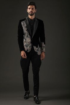 Elevate your style with our Men's Made-to-Measure Black Velvet Blazer, adorned with intricate heavy floral hand embroidery. This exquisite piece is the perfect choice for groomsmen, weddings, or sophisticated cocktail events. Impeccably tailored to your measurements, it exudes luxury and refinement, making a statement that seamlessly blends tradition with contemporary elegance. Step into the spotlight with this unique and distinguished outfit, showcasing your individuality in every stitch.  Welcome to THE MAGNUS ATELIER on Etsy! We want to ensure your shopping experience is delightful and transparent. Please take a moment to review our shop policies before purchasing: 1. Processing Time: Each item is carefully crafted and made to order. Please check the individual product listing for the e Brocade Sets With Floral Embroidery For Reception, Traditional Black Sherwani With Floral Embroidery, Festive Black Bandhgala With Floral Embroidery, Elegant Bandhgala With Floral Embroidery For Reception, Formal Black Embellished Sherwani, Black Embellished Sherwani For Formal Occasions, Designer Embroidered Sets For Reception, Traditional Black Tuxedo For Groom, Traditional Black Groom Tuxedo