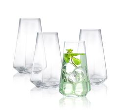 four glasses filled with water and ice cubes