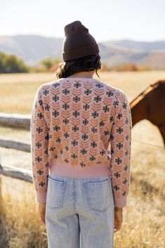 The Meadow Floral Cardigan is one you want in your closet. Featuring floral material, functional buttons, and thick material, this pretty pink cardi will bring some joy to those gloomy winter days! // paired with the on my own tie waist pants Pink Sweater For Cold Weather In Fall, Pink Buttoned Cardigan For Winter, Pink Sweater For Spring Cold Weather, Pink Floral Print Outerwear For Fall, Pink Sweater For Fall Cold Weather, Pink Cardigan For Cold Weather In Spring, Pink Sweater For Cold Spring Weather, Pink Soft Knit Outerwear For Cold Weather, Spring Pink Soft Knit Outerwear