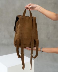 Suede soft backpack for women! Incredibly soft to touch, easy to wear, comfortable to use and stylish minimalist design! it's all about our cute backpack.  It is a stylish and comfortable accessory for studying or walking!  ⭐ Backpack made of soft brown suede, fastened with a drawstring with a lock.  ⭐ The shoulder straps are adjustable, so you can easily find the right size for wearing  ⭐ You can carry at your side, handhold, or wear it on your back. ⭐ Size: 13,4x9,4x5,1 in (34 x 24 x 13 cm) ⭐ Versatile Everyday Backpack Softback, Versatile Softback Backpack For Daily Use, Versatile Everyday Softback Backpack, Everyday Versatile Softback Backpack, Versatile Backpack With Adjustable Straps And Softback, Brown Leather Backpack For Everyday And Back To School, Versatile Softback Backpack With Adjustable Straps, Casual Leather Softback Backpack With Adjustable Strap, Brown Backpack With Adjustable Strap