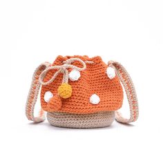 PRICES MAY VARY. Material: The mushroom bag is made of high-quality wool outer layer, which is soft, comfortable and durable. Size: (W) 6.7" x (H) 5.9" x (T) 6.7". The length of the shoulder strap is not adjustable, which enough to carry on the shoulder and cross-body. 1 main pocket with drawcord closure, which big enough to hold your everyday items like wallet, phone, keys and cosmetic etc. Cute Design: The mushroom shape is perfect for matching cute dressing style, making you more lovely and d Colorblock Crochet, Crochet Bucket Bag, Pom Pom Decor, Decor Crochet, Crochet Bucket, Bucket Handbags, Bags For Teens, Novelty Bags, Orange Bag