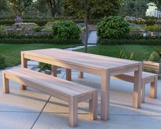 a wooden table and two benches in a park