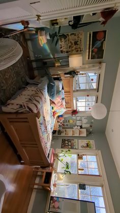 an overhead view of a bedroom and living room from the second floor looking down on the bed