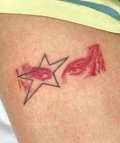 a close up of a person's arm with a tattoo design on the side