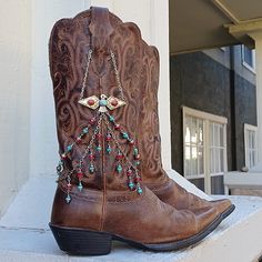 Turquoise Red Silver Thunderbird Handmade Boot Jewelry Cowgirl Boot Bracelet With Matching Earrings! One Of A Kind Handmade Western Boot Bracelet Very Simple Design The Top Chains Secure Behind The Pull With A Lobster Clasp! Jewelry Won't Move Around Or Accidentally Be Stepped On, I Designed These To Be Worn Even While Dancing! Style Was Awarded A Blue Ribbon From The State Fair Of Texas In 2023! This Is A Very Unique Piece Of Boot Jewelry! The Focal Point Of This Boot Jewelry Is A Silver Metal Thunderbird, Boasting 2 Chains That Drape Around The Shaft Of The Boot. The Top Chain Is All Hand Made As Are Each Of The Dangles To Perfectly Complement The Center. All Of My Jewelry Is One Of State Fair Of Texas, Boot Chains, Boot Bracelet, Boot Bling, Western Boutique, Boutique Ideas, Cowgirl Boot, Handmade Boot, Boot Jewelry