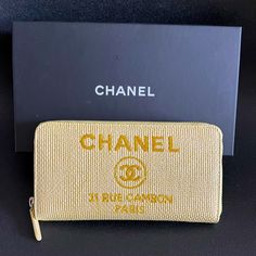 Chanel Deauville Zip Around Wallet. Can Be Used As A Small Bag. Yellow/Gold Embroidery Chanel Logo, 31 Rue Cambon, Paris 2018 Collection By Karl Lagerfeld. With Authenticity Certificate. Dimensions: 7,4” X 4,1” Inches (19 X 10.5 Cms) Chanel Black Dust Bag & Box Luxury Gold Wallets For Travel, Luxury Gold Wallet For Travel, Embroidery Chanel, 31 Rue Cambon, Chanel #1, Navy Chanel, Authenticity Certificate, Quilted Wallet, Chanel Logo