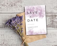 the save the date card is next to some lavender flowers on a piece of paper