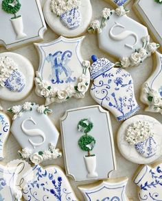 decorated cookies with blue and white designs on them