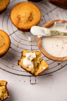 muffins cooling on a wire rack with cream