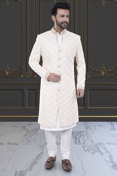 Stay stylishly cool with our Mens Sherwani featuring an open collar. Perfect for any occasion, this Sherwani adds a touch of class to your ensemble. Upgrade your wardrobe now with R14-S77. Classic Long Sleeve Traditional Formal Wear, Classic Formal Traditional Wear For Eid, Classic Unstitched Traditional Wear For Formal Occasions, Classic Bandhgala For Eid Festivities, Classic Bandhgala For Eid Festival, Designer Nehru Jacket With Naqshi For Formal Occasions, Classic Unstitched Kurta For Formal Occasions, Classic Traditional Wear With Traditional Drape For Formal Occasions, Classic Traditional Wear With Traditional Drape For Formal Events