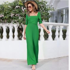 New Green Square Neck Short Sleeve Wide Leg Pant Jumpsuit This Womens Jumpsuits Features A Classic Square Neckline Adding A Touch Of Sophistication And Elegance To The Jumpsuit, Creating A Three-Dimensional And Layered Look That Is Sure To Turn Heads, While The Ruched Bodice Adds A Touch Of Glamour And Accentuates Your Curves. It's A Timeless Piece That Will Make You Stand Out. Wide Flowy Leg Short Sleeves Zipper Back Square Neckline Polyester And Elastane Size Large New Without Tags Fitted Wide Leg Jumpsuit Or Romper In Solid Color, High Waist Jumpsuits And Rompers For Summer Workwear, High Waist Solid Jumpsuits And Rompers For Summer, Spring High-waist Jumpsuits And Rompers, Fitted Jumpsuits And Rompers For Spring Date Night, Spring Stretch One-piece Jumpsuit, Stretch Spring Jumpsuit/romper One-piece, Green Fitted Short Sleeve Jumpsuit, Fitted Green Jumpsuit