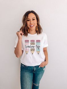 Our cute "Teacher Life" shirt will make the perfect gift for your favorite teacher! Check out all of the photos for color and size charts! Brand: Bella + Canvas - Unisex Short Sleeve Jersey Tee - 3001CVC Printing Method: DTG Care: Machine Wash Inside Out on Cold. Tumble Dry Low. Material: 100% Cotton or Cotton Poly Blend Depending on Shirt Color Runs True to Size White Tops For Teacher Appreciation Back To School, Color Run, Teacher Favorite Things, Jersey Tee, Unisex Shorts, Teacher Life, Teacher Shirts, Printing Methods, Bella Canvas