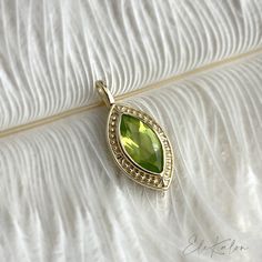 One piece of 9K or 14K Solid Gold Vintage style, Marquise Cut Peridot Pendant  * Metal: 9K or 14K Yellow Gold * Stone Info: Natural Peridot, 10x5mm Marquise Cut * Pendant Size: From Bail to bottom,  approx. 20mm L x 8.5mm W x 4.13mm H * Bail Size: 3.62mm in length * Pendant Stamp: 9K or 14K * 16.5" Chain is optional * Chain Metal: 14K Solid Gold * Chain Stamp: 14K ❤️Visit our official website for exclusive new products.      https://elekalonjewelry.com/ ❤️Follow us on Instagram @ elekalonjewelry Luxury Peridot Birthstone Necklaces, Fine Jewelry Lime Green Gemstone, Peridot Jewelry With Gemstone Accents For May Birthstone, Peridot Gemstone Jewelry For May Birthstone, Peridot Gemstone Wedding Jewelry, Wedding Jewelry With Peridot Gemstone Accents, Yellow Gold Peridot Gemstone Jewelry, Gold Peridot Gemstone Jewelry, Gold Peridot Jewelry With Gemstone