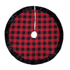 a red and black buffalo checkered rug with a white circle hanging from the center