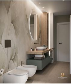 a bathroom with two sinks, toilet and mirror in the wall next to each other