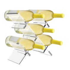 four wine glasses with yellow handles are lined up against a white background and one glass is upside down