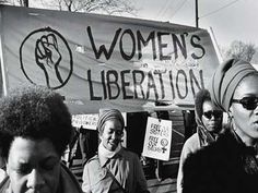 black and white photograph of women's liberation march in washington, d c with sign