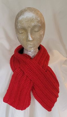 Handmade winter keyhole scarf. Crocheted neckwarmer pull-through scarf. Options with pull through to change styles. Ribbed pattern in deep red. Measures 44 X 6 inches. Ready to ship. Red Scarves For Winter Cold Weather, Red Winter Scarves For Cold Weather, Cozy Red Scarves For Winter, Red Knitted Scarf For Winter, Red Hand Knitted Scarves One Size, Red Hand Knitted Scarf One Size, Red Knitted Fall Scarves, Red Knitted Scarf For Fall, Red Knitted Fall Scarf