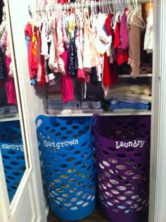 an organized closet with laundry baskets and clothes