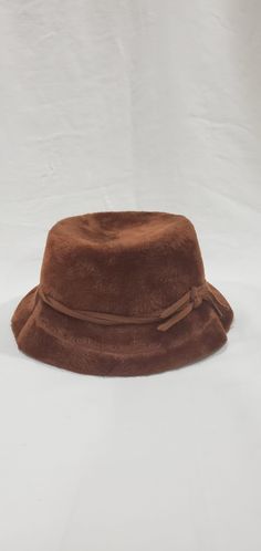 "This stunning 1950's Faux Fur hat was made by Musketeer in Austria. This beautiful hat is constructed of brown wool felt & covered in luxurious brown faux fur, accented with a twisted fur band. 20\" band size" Fur Band, Felt Cover, Faux Fur Hat, Fur Hat, Beautiful Hats, Vintage 1950s, Wool Felt, Austria, Faux Fur