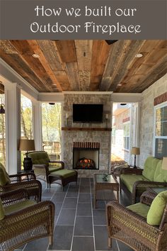 a screened porch with wicker furniture and fireplace