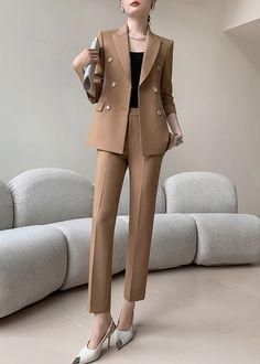 Indulge in the luxurious style of our Gillian Double Breasted Blazer & Cropped Pants Two-Piece Set. This set features a sophisticated double-breasted blazer and cropped pants in a timeless khaki color. Elevate your wardrobe with this exclusive and tasteful set, perfect for any elegant occasion. Blazer: Double-breasted button closure Notched lapels Long sleeves Front flap pockets Pants Zip fly with button closure Side slant pockets Cropped length - Polyester, spandex- Item #432604- Women's blazer Elegant Fall Set With High-waisted Pants, Beige Formal Pantsuit With Straight Pants, Beige Straight Pantsuit For Formal Occasions, Tailored Beige Office Sets, Formal Beige Pantsuit With Straight Pants, Elegant Formal Set With High-waisted Pants, Beige Tailored Sets For Workwear, Elegant Tailored Sets With Pockets, Fall Office Sets With High-waisted Pants