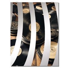 several records stacked on top of each other in front of a white and black background