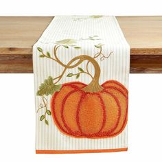 a table runner with a pumpkin on it