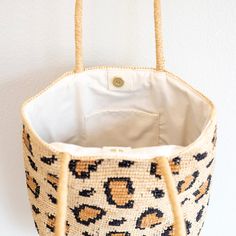 IN STOCK FAST SHIPPING FROM LOS ANGELES Unleash your wild side with the Elena Handbags Leopard Design Raffia Summer Tote Bag! Made from durable straw raffia, this summertime essential features a trendy leopard print that will add a touch of fun to any outfit. Perfect for carrying all your essentials, this bag is a must-have for the summer season. Natural Soft Raffia Straw Handmade Inside pocket Fully lined Size: 12"H x 14.5"W x 5.5"D Strap drop length: 10.5" Designer Style ID: 8690 Eco-friendly Bags With Bamboo Handle For Vacation, Bucket Bags With Bamboo Handle For Beach Season, Beach Season Bags With Bamboo Handle, Beach Season Bags With Bamboo Handle And Natural Fiber, Vacation Crochet Bucket Bag With Bamboo Handle, Beach Season Bucket Bag With Bamboo Handle, Natural Fiber Bags With Bamboo Handle For Beach Season, Beach Shoulder Bag With Bamboo Handle In Bucket Shape, Handheld Natural Fiber Bags For Vacation