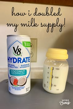 a can of yogurt next to a bottle of coconut water on a counter