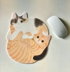 a mouse pad with two cats on it