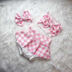 This Beautiful pink plaid print is perfect for your little dolls movie themed birthday party. Your little Sweetheart will be the star of the show when they are rocking this pink checker print outfit.  Now in skirted leggings to keep those little legs warm in the coolor seasons. Choose from adorable baby bummies (diaper cover), Skirted Bummies, Baby Bells, Bow on Nylon, Bow Headband, and more.  Liverpool fabric ensures longevity of the fit while being breathable. Stylish enough to wear for photo Cute Fitted Gingham Sets, Cute Plaid Playtime Sets, Cute Pink Set With Matching Headband, Pink Cotton Party Sets, Sweet Pink Sets For Birthday, Pink Cotton Sets For Gifts, Cute Pink Gift Sets, Sweet Pink Birthday Sets, Sweet Pink Birthday Set