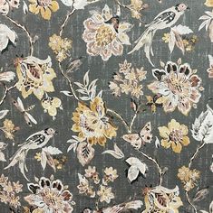 a floral pattern with birds and flowers on a gray background that is very similar to the wallpaper