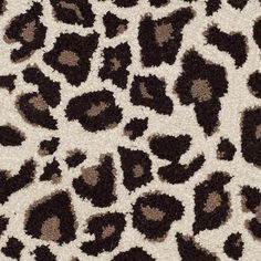 an animal print fabric with black and brown spots