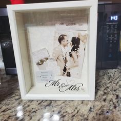 a white frame with an image of a couple holding each other