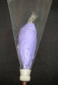 a purple umbrella is wrapped in plastic