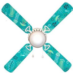 a ceiling fan with an ocean theme on the blades and two white balls hanging from it's center