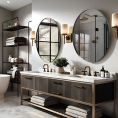 a bathroom with two round mirrors above the sinks and a tub in front of it