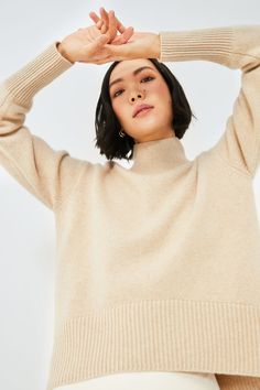 AEXAE is a contemporary ready to wear brand founded in 2015 by Australian-born, Brazilian-Spanish designer, Amelia Perez. Renowned for its minimalist approach to dressing, AEXAE creates tailored yet relaxed silhouettes, blending form and functionality.Beautifully crafted from buttery soft cashmere, the Beige Roll Neck Jumper is made for ultimate warmth and comfort. An essential for your wardrobe, this clean yet comfortable sweater features drop shoulders, a rounded hem, and a relaxed fit. We are styling this silhouette with denim, trousers, skirts — it's perfect for slow weekend getaways, chilly afternoon strolls, lunch dates, and more. 
Roll neck
Drop shoulders
Long sleeves
Rounded hem
Relaxed fit
Ribbed detailing throughout
Material: 100% Cashmere
Care: Dry clean only Roll Neck Jumpers, Comfortable Sweater, Cocktail Attire, Cashmere Jumper, Beige Sweater, Roll Neck, Pullover Sweatshirts, Fall Trends, Skirt Pants