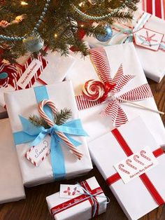 several wrapped presents under a christmas tree