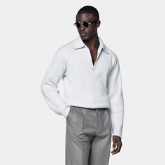 This light blue buttonless polo is tailored to a slim fit and features a ribbed texture, long sleeves, and a classic polo collar. Oversized White Cardigan, Grey Sweatsuit, Brown Crewneck, Purple Crewneck, Polo Cardigan, Navy Crewneck, Green Polo Shirts, Black Polo Shirt, White Polo Shirt