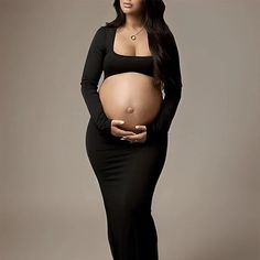 This Black Maternity Cut Out Dress You Can Wear Is At Your Photoshoot Or Baby Shower Elegant Black Long Sleeve Maternity Dress, Black Stretch Maternity Dress, Black Fitted Long Sleeve Maternity Dress, Black Maternity Dress For Party, Black Party Maternity Dress, Fitted Black Maternity Dress For Party, Black Fitted Maternity Dress For Party, Fitted Long Sleeve Maternity Evening Dress, Fitted Long Sleeve Evening Maternity Dress