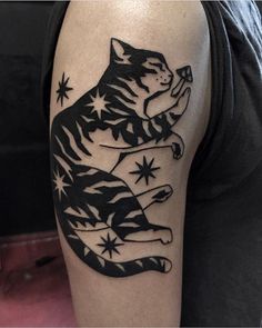 a man's arm with a black and white wolf tattoo on it