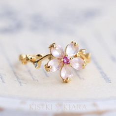 18K Solid Gold Rose Quartz Crystal Flower Ring, Japanese Peach Blossoms Floral Ring, Pink Rose Quartz Crystal Ring, Flower Shaped Ring DETAILS ♡⃛ ⃛ Main stone: Rose Quartz Side stone: Pink Tourmaline, Moissanite Band width: 1.5mm Band thickness: 1.2mm OUR GEMSTONES ♡⃛ ⃛ At Kiseki Kiara, we use both precious and semi-precious stones throughout our jewelry designs, with each stone set-by-hand in our workshop. We carefully source gemstones for their quality and color ensuring you receive the best q Japanese Peach, Cute Engagement Rings, Rose Gold Quartz, Jewelry Lookbook, Fancy Jewelry, Cute Rings, Pretty Rings, Rose Quartz Crystal, Crystal Flower