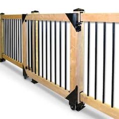 a wooden and metal fence with black bars on the top, against a white background